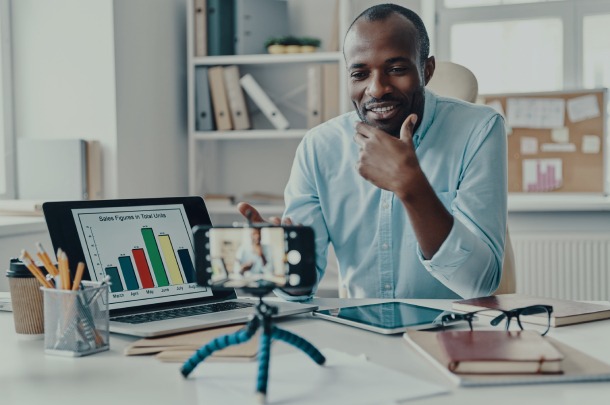 supply-chain-optimization-analyst A full-time financial outsourcings services professional cups her chin while looking on.