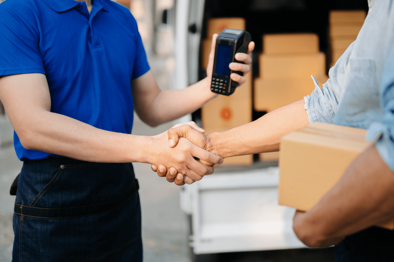 Delivery worker handling parcel—symbolizing last mile delivery solutions and logistics efficiency