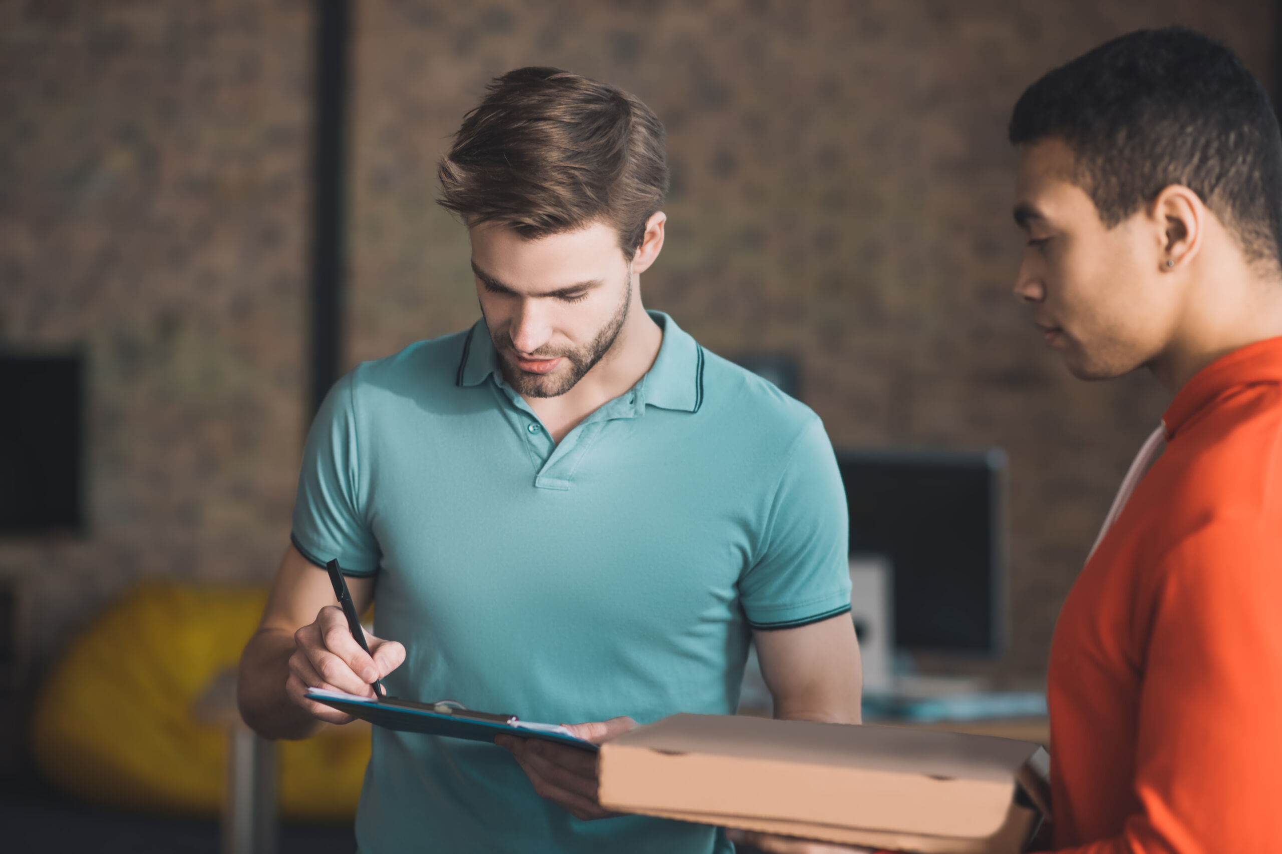 Entrepreneur reviewing delivery performance with their supply chain partner